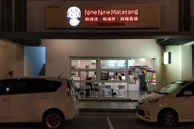 two white cars parked in front of a store at M Vertica in Kuala Lumpur