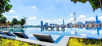 a bench with a view of a city at M Vertica in Kuala Lumpur