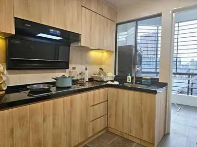 a kitchen with a stove and a microwave at Fahrenheit 88 - Bukit Bintang in Kuala Lumpur