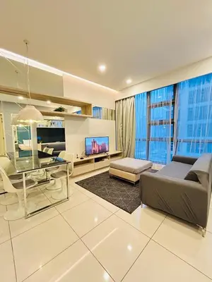 a large living room with a couch and a table at Robertson Suites At Bukit Bintang Kuala Lumpur in Kuala Lumpur