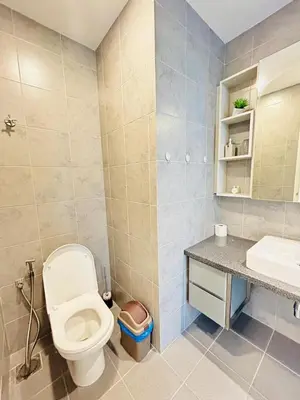 a bathroom with a toilet and a sink at Robertson Suites At Bukit Bintang Kuala Lumpur in Kuala Lumpur
