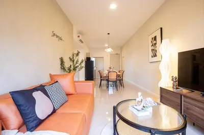 a living room with a couch and a table at Kids Friendly Homestay at Riana Dutamas in Kuala Lumpur