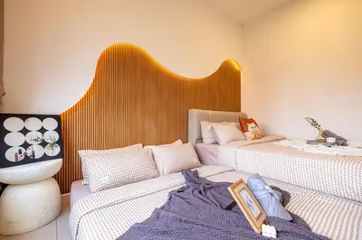 two beds sitting next to each other in a room at Kids Friendly Homestay at Riana Dutamas in Kuala Lumpur