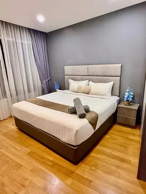 a bedroom with a large bed in a room at Vortex Apartment Near By Klcc in Kuala Lumpur