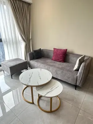 a living room with two tables and a couch at AGILE SKY HOME Near Pavilion with TRX and GOLF View Including Swimming Pool in Kuala Lumpur