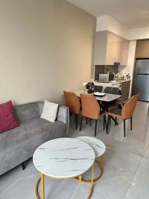 a living room with a couch and a table at AGILE SKY HOME Near Pavilion with TRX and GOLF View Including Swimming Pool in Kuala Lumpur