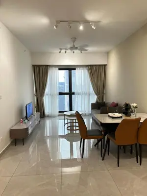 a living room with a table and a dining room at AGILE SKY HOME Near Pavilion with TRX and GOLF View Including Swimming Pool in Kuala Lumpur