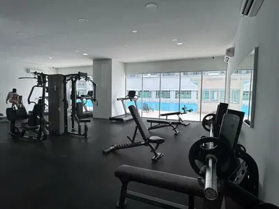 a gym with several treadmills and machines in a room at Razak City Fully Air-Con Suite Sungai Besi Kuala Lumpur 57100 in Kuala Lumpur