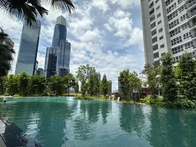 a large pool of water in a city with tall buildings at Agile Bukit Bintang TRX KL by Lilbean Space - 2B1R in Kuala Lumpur