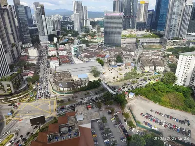 an aerial view of a city with traffic at The Marvelous Suites at Times Square Kuala Lumpur in Kuala Lumpur