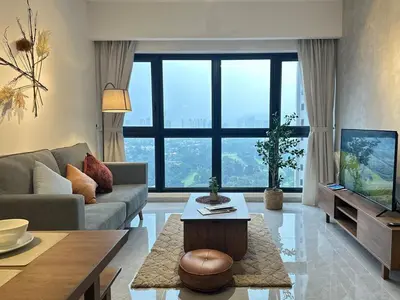 a living room with a couch and a tv at Agile Bukit Bintang TRX KL by Lilbean Space - 2B1R in Kuala Lumpur