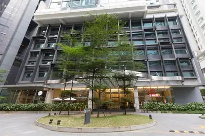 a tree in front of a building at Binjai 8 Signature by PSM in Kuala Lumpur