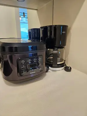 a microwave and a coffee maker on a counter at Sky suites KLCC Level 58, 600Mbps WiFi - 2R plus 1BB in Kuala Lumpur