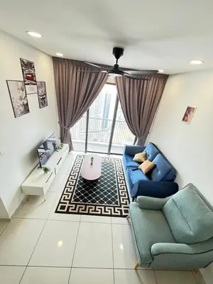 a living room with a blue couch and a table at Cozy 2BR 2BR 2-5 Pax Kenwingston KL Genting View & Parking & Netflix 4505 in Kuala Lumpur