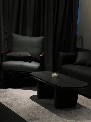 a living room with a coffee table and a chair at Luxury Black Suite Agile Bukit Bintang in Kuala Lumpur