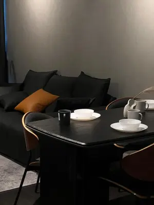 a black table with two cups and plates on it at Luxury Black Suite Agile Bukit Bintang in Kuala Lumpur