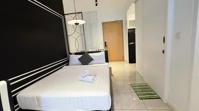 two beds in a room with two white beds at AXON Residence Near TRX & Pavilion KL in Kuala Lumpur