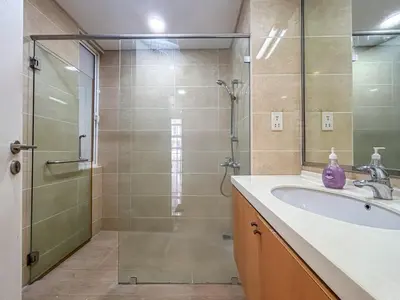 a bathroom with a glass shower and a sink at Bintang Goldhill, 5M to TRX in Kuala Lumpur