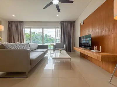 a living room with a couch and a tv at Bintang Goldhill, 5M to TRX in Kuala Lumpur