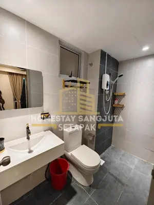 a bathroom with a white toilet and a sink at Homestay SANGJUTA Setapak - Kid Friendly in Kuala Lumpur