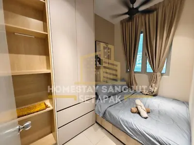 a bedroom with a bed and a window at Homestay SANGJUTA Setapak - Kid Friendly in Kuala Lumpur