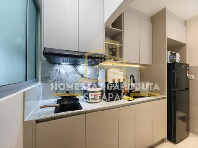 a kitchen with a stove and a refrigerator at Homestay SANGJUTA Setapak - Kid Friendly in Kuala Lumpur