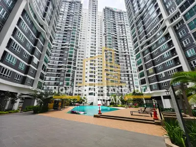 a large apartment complex with a swimming pool in front of tall buildings at Homestay SANGJUTA Setapak - Kid Friendly in Kuala Lumpur