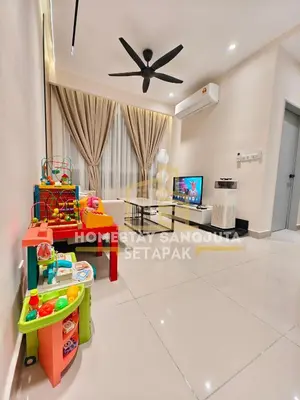 a living room with a ceiling fan at Homestay SANGJUTA Setapak - Kid Friendly in Kuala Lumpur