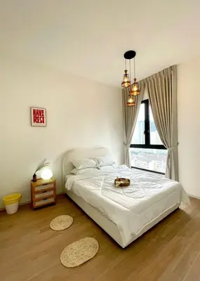 a bedroom with a bed and a window at Cozy Urban Retreat in the Heart of the Bangsar in Kuala Lumpur