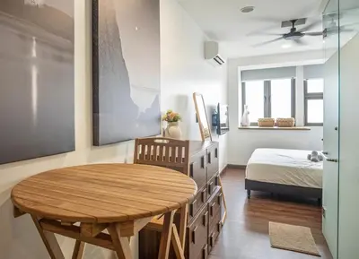 a room with a table and a bed and a bedroom at Cozy Studio l Riveria City l 1km to KL Sentral in Kuala Lumpur