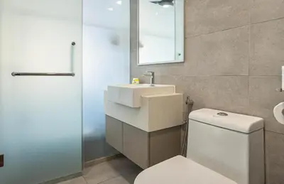 a bathroom with a white toilet and a sink at Cozy Studio l Riveria City l 1km to KL Sentral in Kuala Lumpur