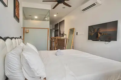 a white bed with white pillows in a bedroom at Cozy Studio l Riveria City l 1km to KL Sentral in Kuala Lumpur