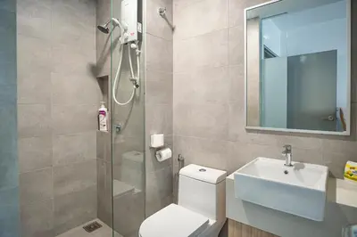 a bathroom with a shower and a toilet and a sink at Cozy Studio l Riveria City l 1km to KL Sentral in Kuala Lumpur