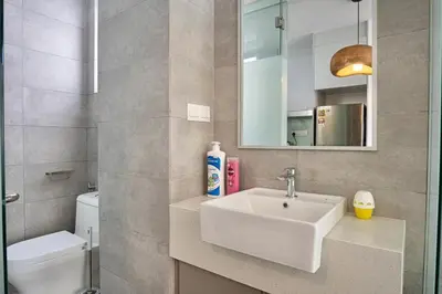 a bathroom with a sink and a toilet and a mirror at Cozy Studio l Riveria City l 1km to KL Sentral in Kuala Lumpur