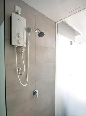 a shower with a shower head in a bathroom at Cozy Studio l Riveria City l 1km to KL Sentral in Kuala Lumpur