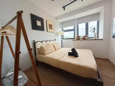 a bedroom with a large bed with a ladder at Cozy Studio l Riveria City l 1km to KL Sentral in Kuala Lumpur