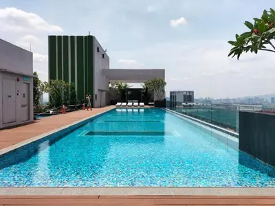 a swimming pool on the roof of a building at Cozy Studio l Riveria City l 1km to KL Sentral in Kuala Lumpur