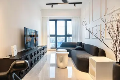a living room with a couch and a tv at Cozy Unit l Agile BB l 5min walk to TRX Pavilion in Kuala Lumpur