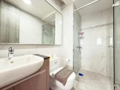 a bathroom with a sink and a toilet and a shower at Cozy Unit l Agile BB l 5min walk to TRX Pavilion in Kuala Lumpur