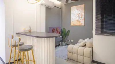 a living room with a bar and a couch at Homey 2BR l Neu Suites l 5min to KL City in Kuala Lumpur