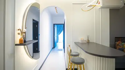 a kitchen with a counter and a mirror on the wall at Homey 2BR l Neu Suites l 5min to KL City in Kuala Lumpur