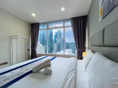 a bedroom with a bed and a large window at Vortex Suites Klcc by BEST TO BEST in Kuala Lumpur