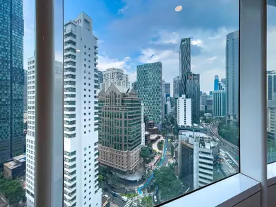 a view of a city skyline from a skyscraper at Vortex Suites Klcc by BEST TO BEST in Kuala Lumpur