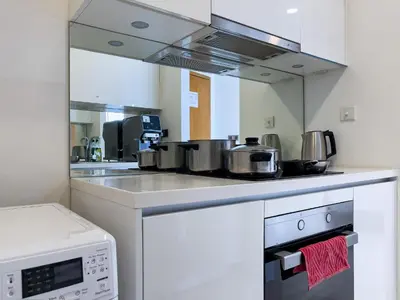 a kitchen with a counter top with pots and pans at Vortex Suites Klcc by BEST TO BEST in Kuala Lumpur