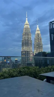 a view of two tall buildings in a city at One Star KLCC in Kuala Lumpur