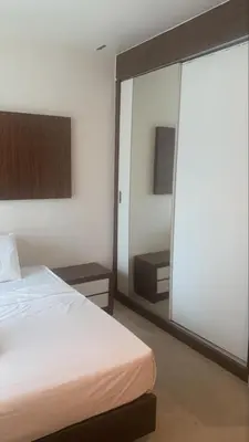 a bedroom with a bed and a large sliding glass door at RaarFAM Homestay in Kuala Lumpur