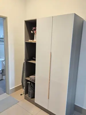 a large white cabinet in a room at Razak City Kuala Lumpur D4 09 in Kuala Lumpur