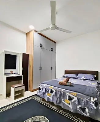 a bedroom with a bed with a teddy bear on it at Inap KL in Kuala Lumpur