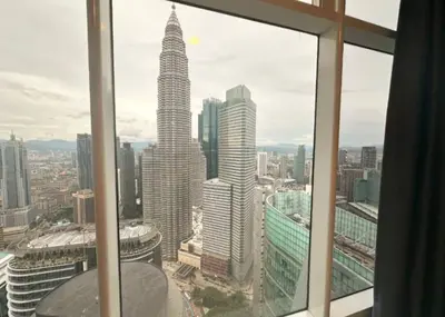 a view of a city skyline from a window at Sky Suites Klcc By KD STAR Luxury Suites in Kuala Lumpur