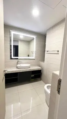 a bathroom with a sink and a mirror and a toilet at One Star KLCC in Kuala Lumpur